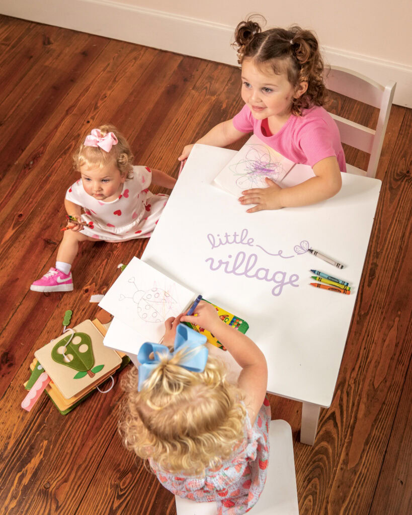 Children at The Village social club engaging in creative activities in San Antonio.