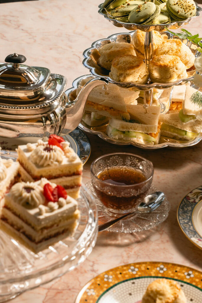 The Village community enjoying tea and desserts at a social event in San Antonio.
