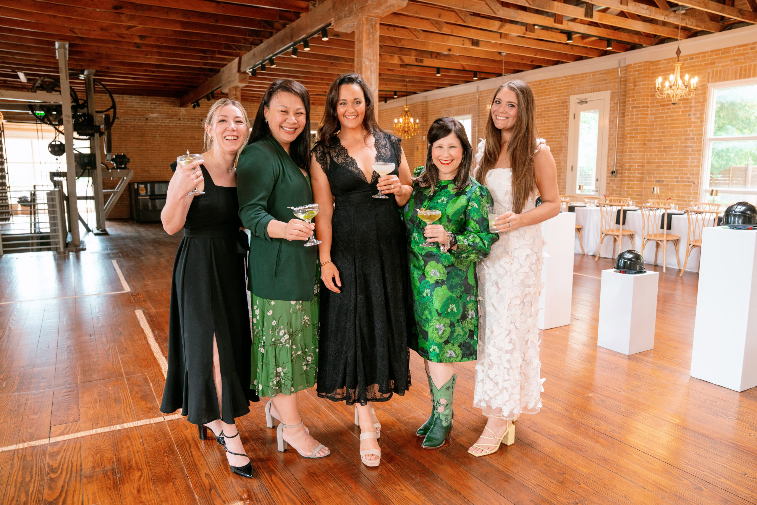 Group of women celebrating at The Village event space.